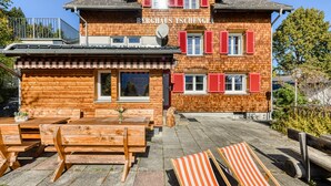 A wooden building with a sign reading "BERGHAUS TSCHENCA". - Berghaus Tschengla (Buerserberg)