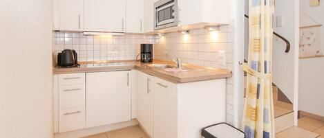 Microwave, stovetop, coffee/tea maker, electric kettle