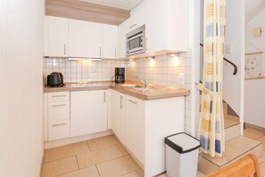 Microwave, stovetop, coffee/tea maker, electric kettle