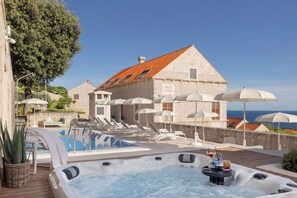 Seasonal outdoor pool, open 8:00 AM to 8:00 PM, pool umbrellas