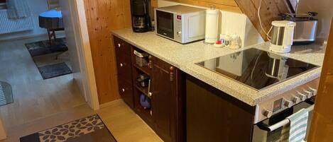 Fridge, microwave, stovetop, coffee/tea maker