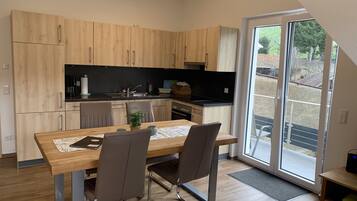 Fridge, stovetop, dishwasher, coffee/tea maker