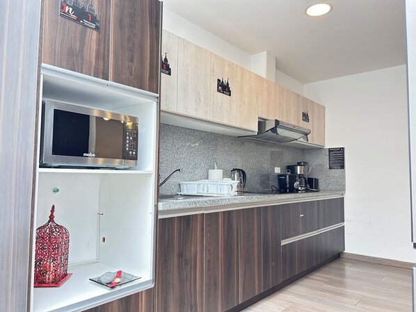 Fridge, microwave, stovetop, coffee/tea maker