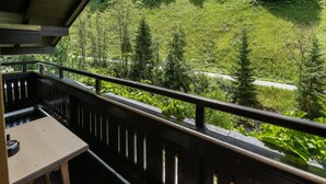 A balcony with a view of a forested hillside. - Chalet in Tirol by Zillertal Ski Slopes (Brandberg)