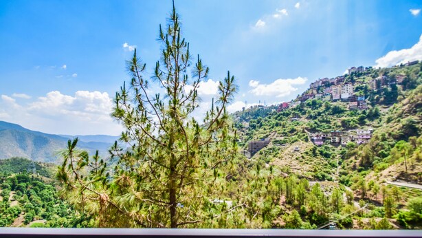 A mountainous landscape with a view of a residential area and a clear sky. - Cliffton Valley by Dumnu Homes (Shimla)