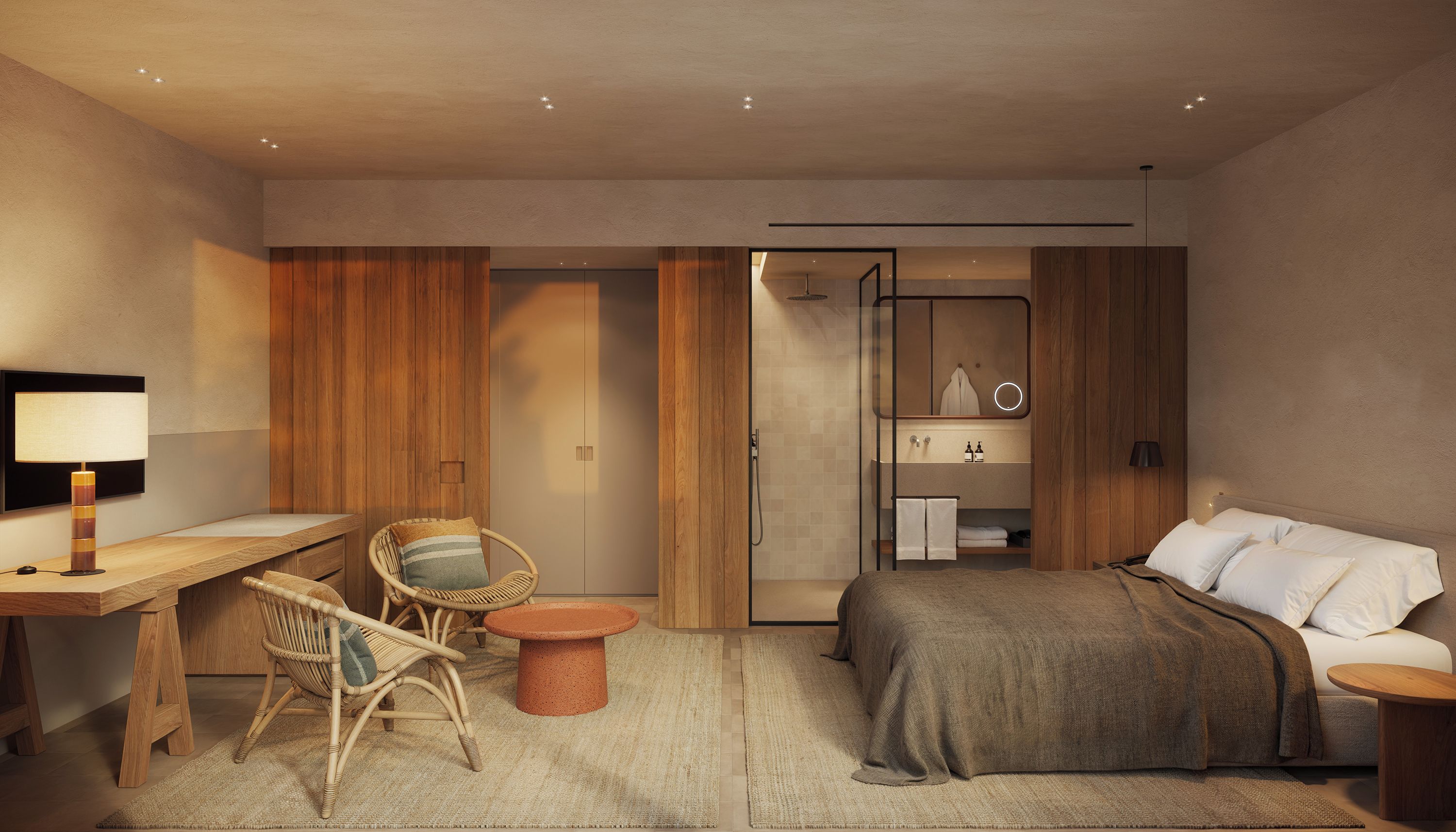 Habitación de hotel moderna con cama, escritorio, silla, una mesita y baño visible a través de una puerta abierta.