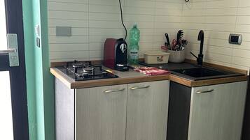 Microwave, stovetop, coffee/tea maker, electric kettle