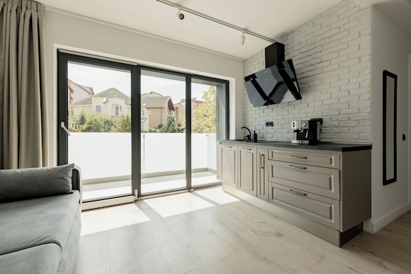 Business Apartment | Private kitchen | Mini-fridge, microwave, stovetop, coffee/tea maker