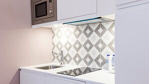 Fridge, microwave, stovetop, coffee/tea maker
