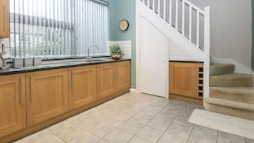 Fridge, electric kettle, cookware/dishes/utensils