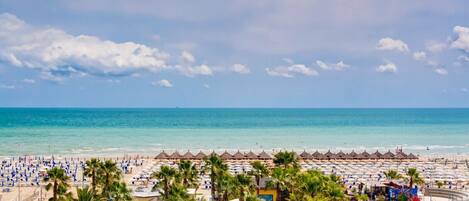 Private beach, white sand, sun loungers, beach umbrellas