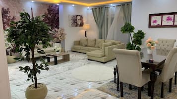 Grand Apartment | Living area | 55-inch Smart TV with satellite channels, TV