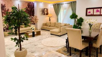Grand Apartment | Living area | 55-inch Smart TV with satellite channels, TV