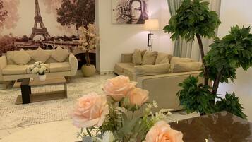 Grand Apartment | Living area | 55-inch Smart TV with satellite channels, TV