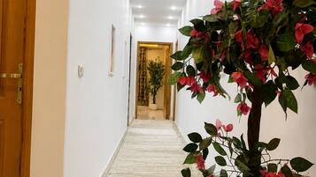 Grand Apartment | Living area | 55-inch Smart TV with satellite channels, TV