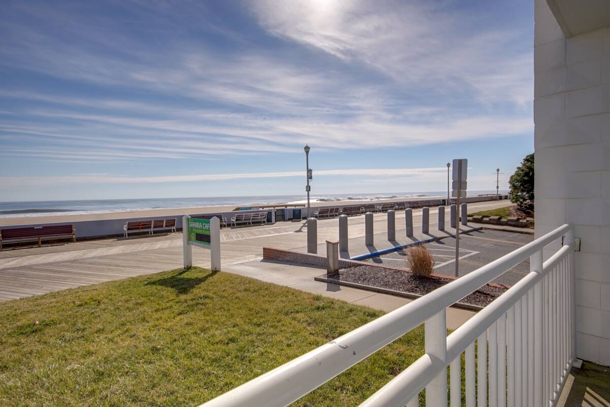 A beachside parking area with a sign indicating 'Sanctuary Car'.