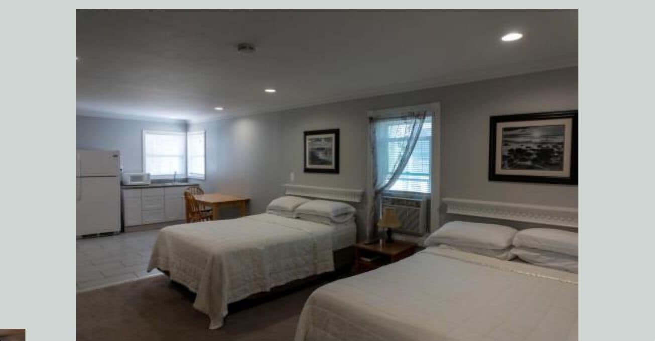 Family Room, 2 Queen Beds | Iron/ironing board, WiFi (free), bed sheets