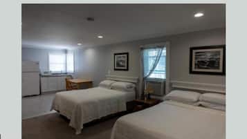 Family Room, 2 Queen Beds | Iron/ironing board, WiFi (free), bed sheets