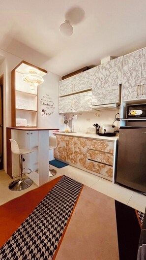 Fridge, microwave, stovetop, electric kettle - Samboy Condo unit besides SM Mall uptown (Cagayan de Oro)