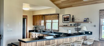 Three-bedroom house with views, decks, golf cart and home gym!