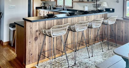 Three-bedroom house with views, decks, golf cart and home gym!