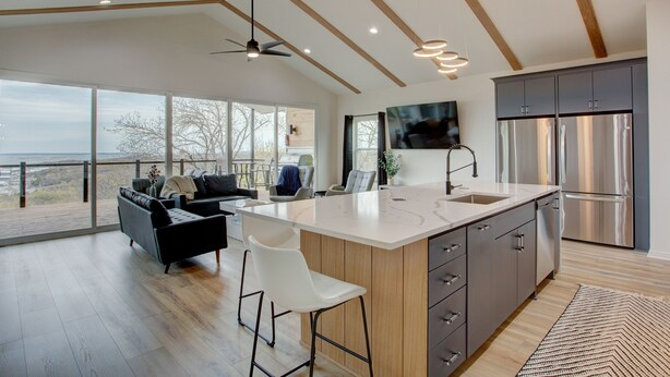 A modern kitchen with a large island, stainless steel appliances, and a view to the outside. - Breathtaking Views of Lake Texoma's beaches/Islands and Highport Marina.
 (Pottsboro)