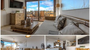 A modern living room with a large TV, wooden furniture, and a balcony with outdoor seating. - HOUSE OF THE SEA (Callao Salvaje)