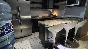 Fridge, microwave, stovetop, coffee/tea maker