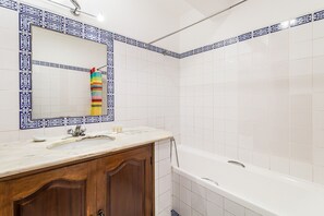 Bathtub, hair dryer, towels
