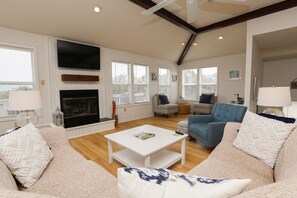 TV, fireplace, books - The Shore Life - 4 BR Beach Home w/Private Pool and Dogs Allowed (Southern Shores)