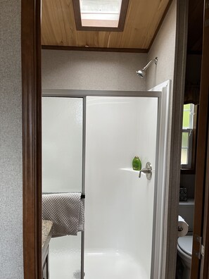 Shower, hair dryer, towels, soap