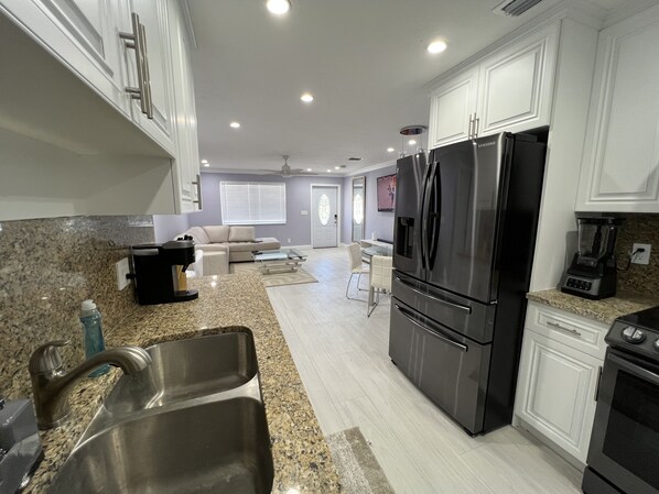 Fridge, microwave, stovetop, coffee/tea maker