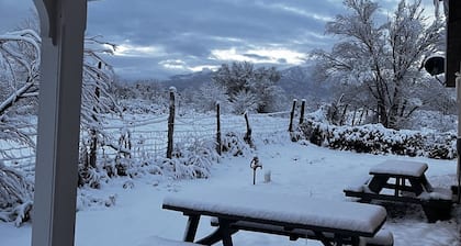Quiet and cozy country home with mountain views in every direction. Sleeps 6