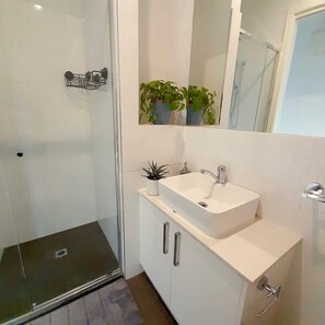 Shower, hair dryer, towels, soap