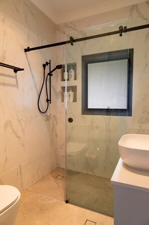 Shower, hair dryer, towels, soap