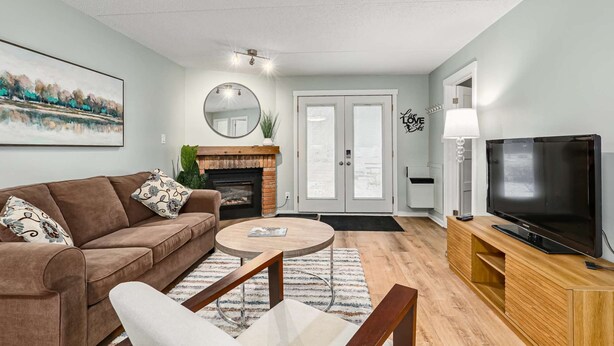 TV, fireplace - The Nordic - Central Collingwood Condo (Collingwood)