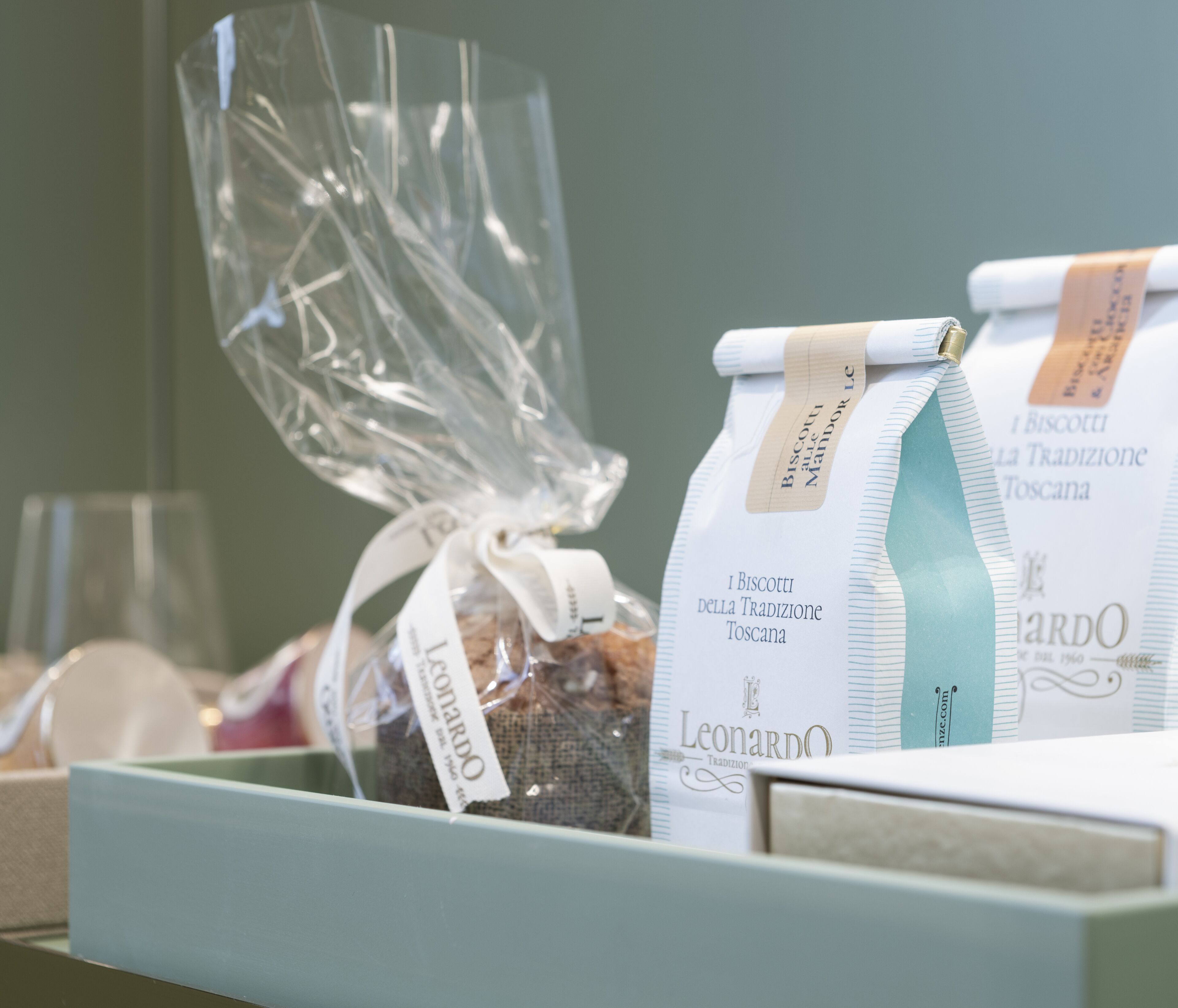 A display of packaged biscotti with labels indicating they are traditional Tuscan biscotti.