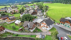 A rural village with traditional houses, a main road, and surrounding green fields. - Apartment in Bad Mitterndorf Near ski Area (Bad Mitterndorf)