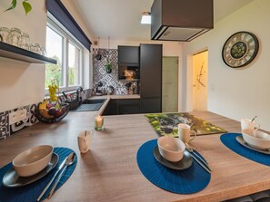 House | Private kitchen | High chair - Holiday Home in Noiseux With Fenced Garden (Somme-Leuze)