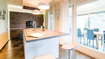 Villa | Private kitchen | Fridge, high chair