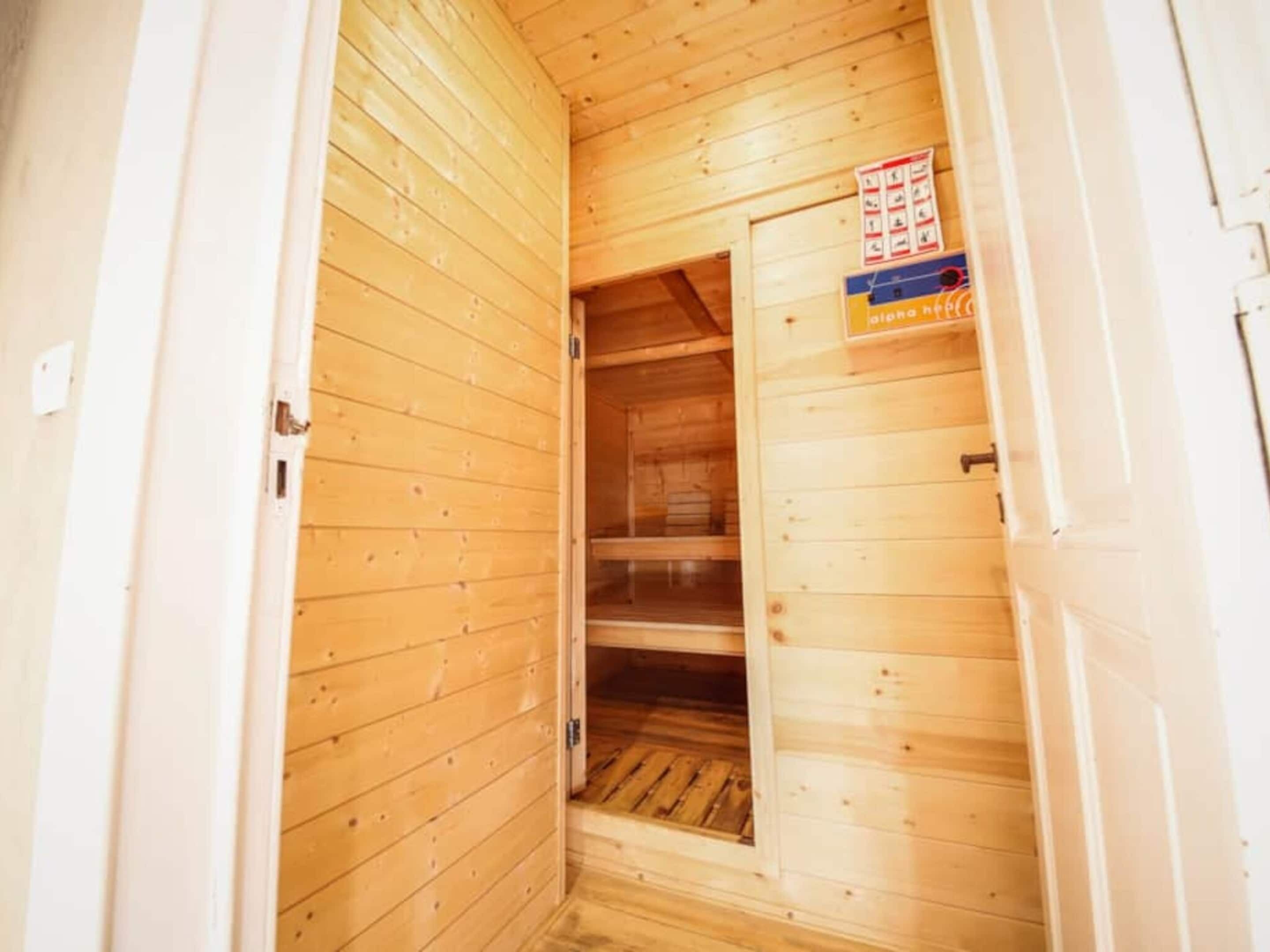 A wooden interior with a door leading to a closet.