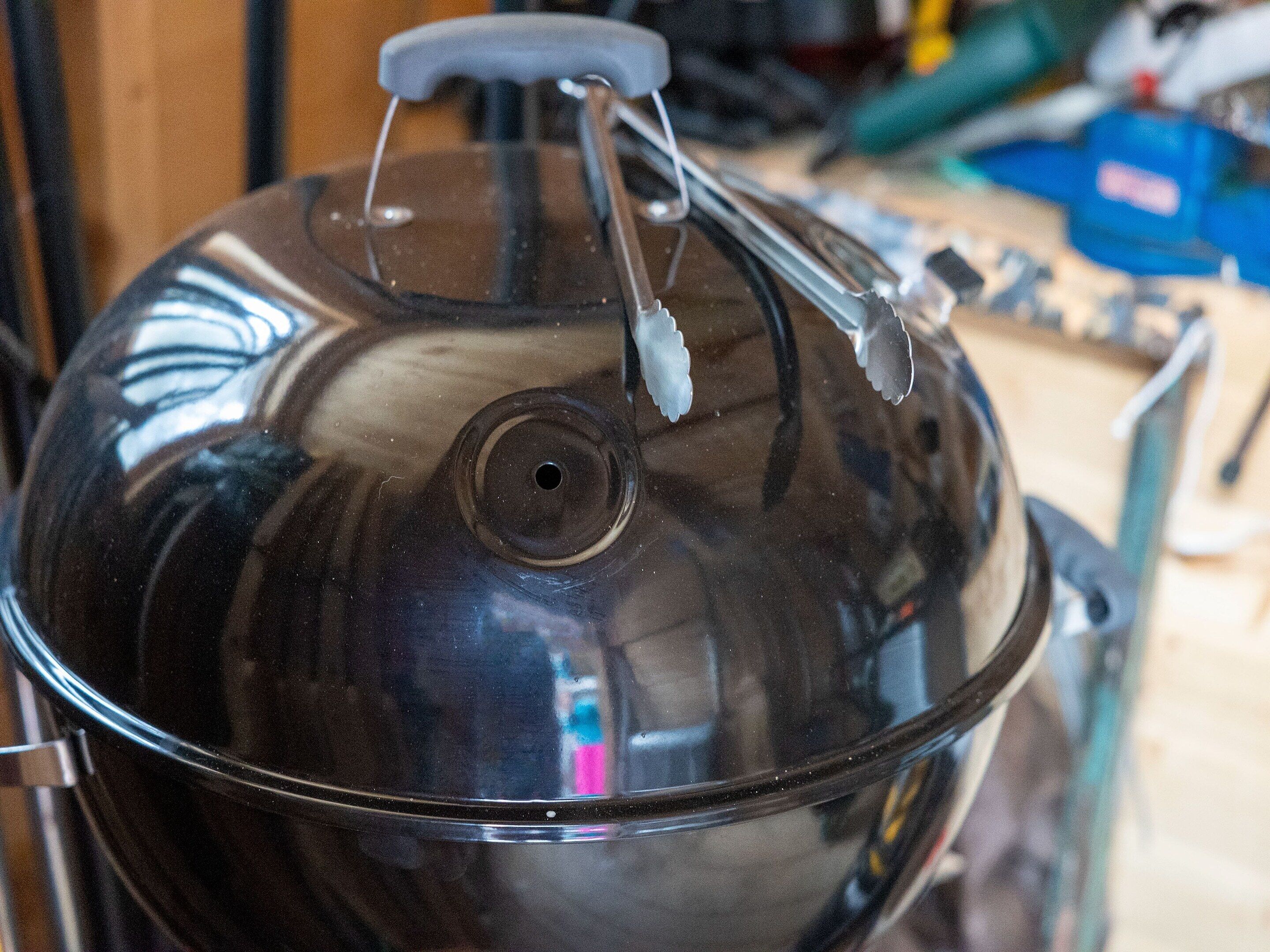 A clear view of a kitchen area with a large, dark-colored pot on a stove.