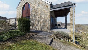 A stone building with a covered patio area. - Holiday Home in Borlon With Terrace (Durbuy)