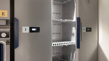 A compact, modern elevator with digital displays and a metal interior.