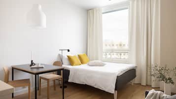 Desk, blackout drapes, soundproofing, iron/ironing board