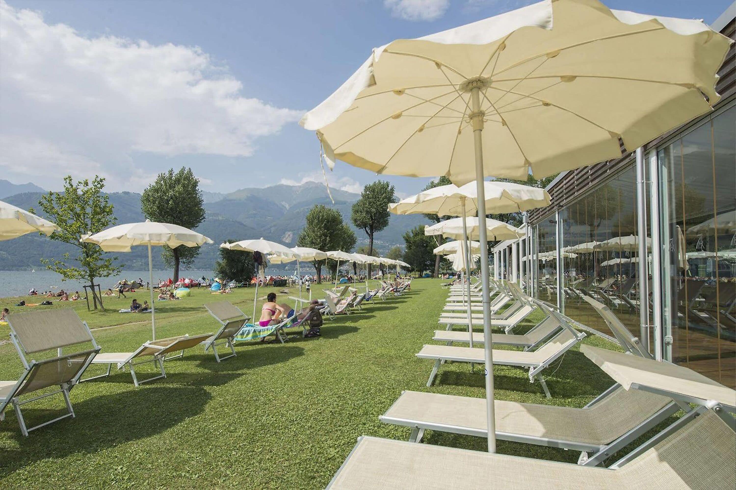 On the beach, sun-loungers, beach umbrellas, waterskiing