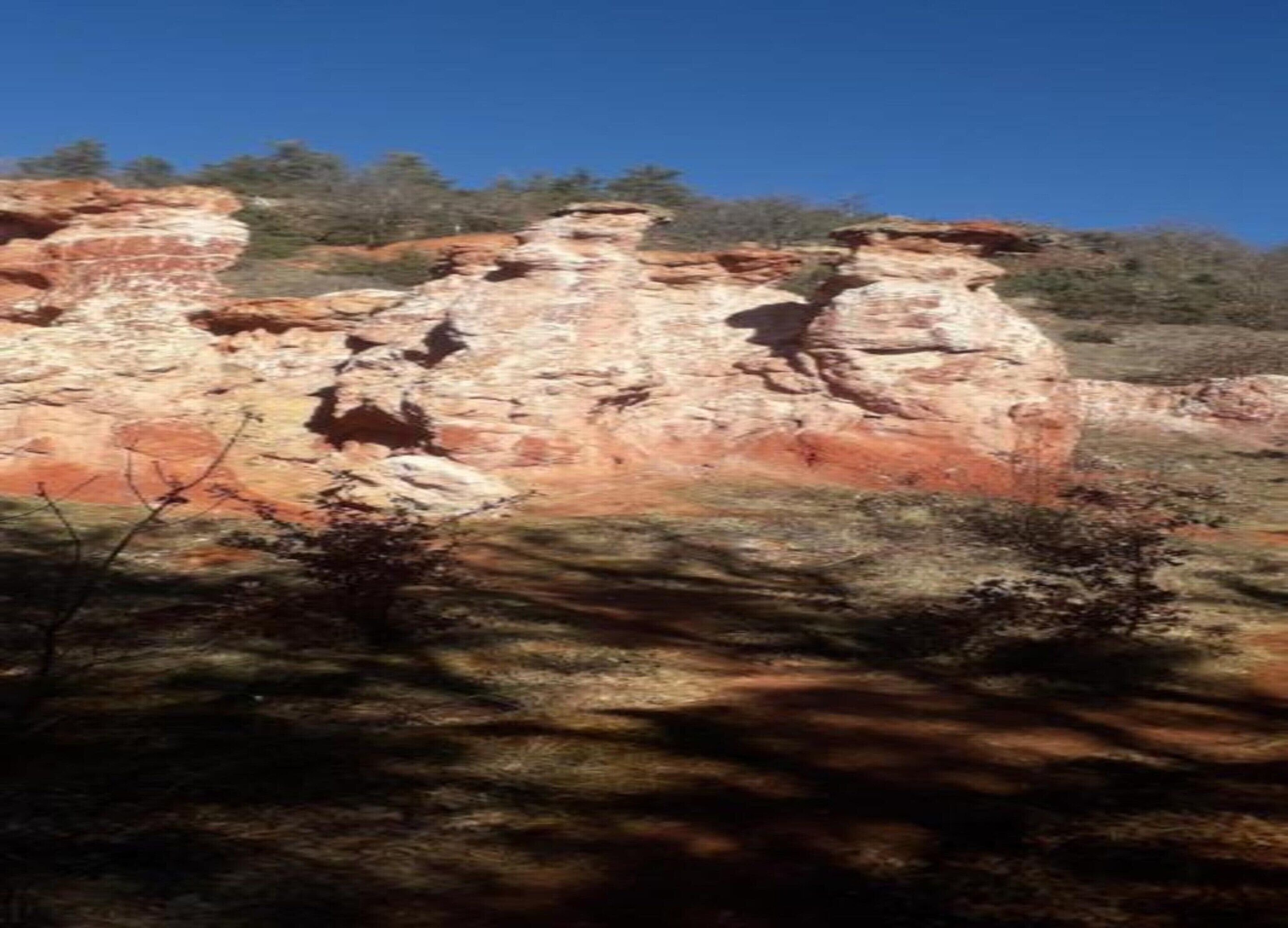 A rocky landscape with a clear sky.