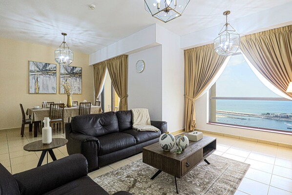 Deluxe Apartment | Living area | 55-inch Smart TV with cable channels, TV