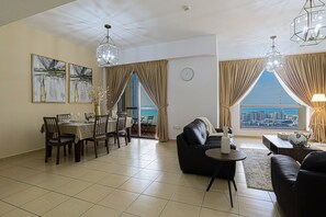 Deluxe Apartment | Living area | 55-inch Smart TV with cable channels, TV