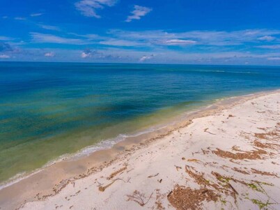 Sunset Beach: Secluded Beachfront Property with Stunning Island Views